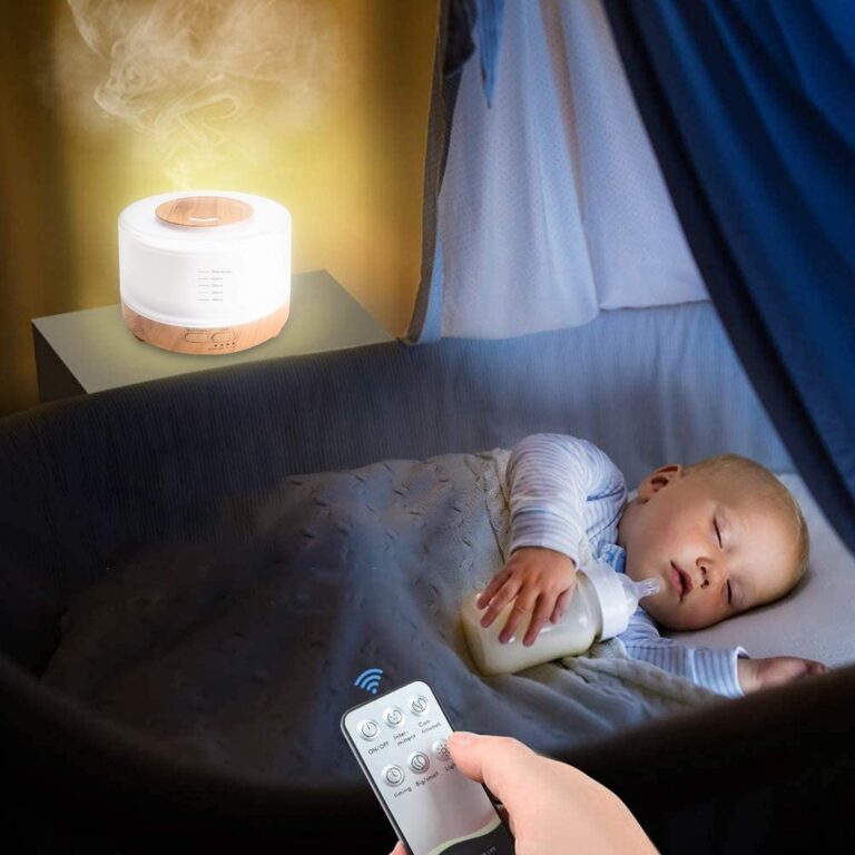 500ml Smart Bluetooth diffuser with remote control on a nightstand while a baby sleeps