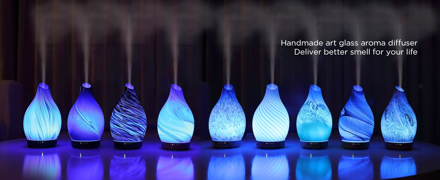 Nine handmade art glass aroma diffusers showing the available art glass design range