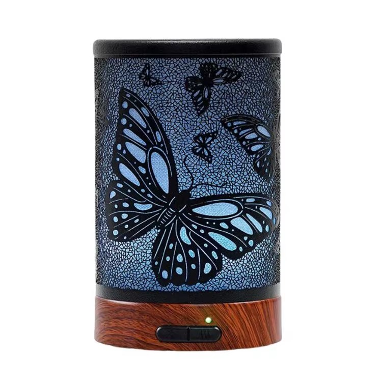 Iron aroma diffuser with a butterfly pattern on a wood grain base