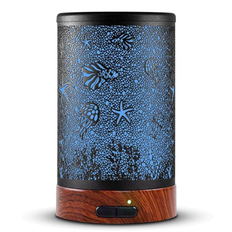 Iron aroma diffuser with a sea life pattern of jellyfish, starfish and coral on a wood grain base